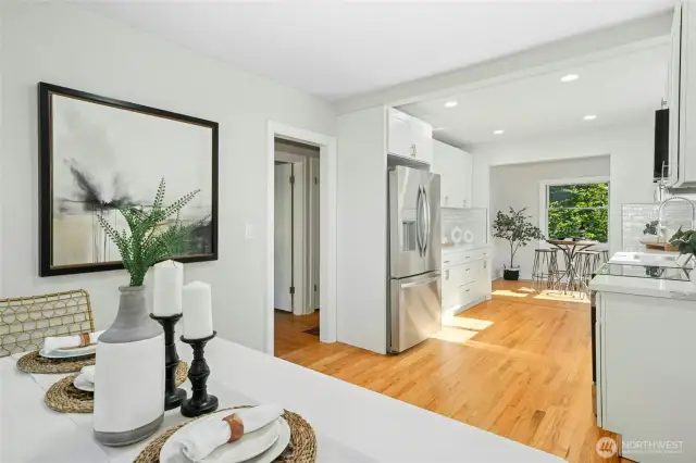 Doorway in photo leads to main floor full bath and main floor bedroom, as well as stairs leading the basement