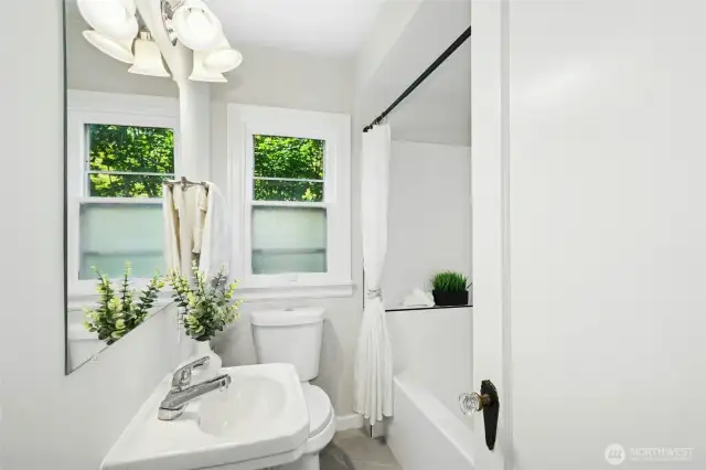 Hall full bathroom with laundry chute behind door - you must come visit so you can see it for yourself!