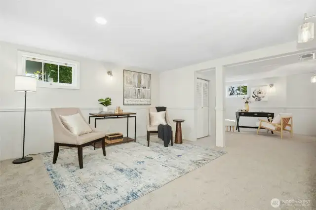 Basement rec room or possibly work-from-home office? Has separate entrance from outside so could be a studio or place to meet clients without coming through the main entrance.