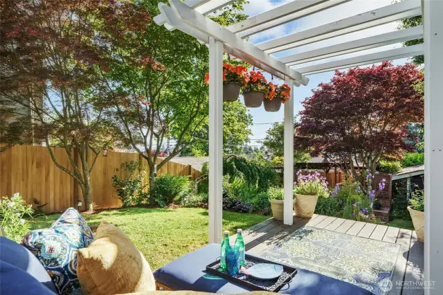 Just outside the family room, you are welcomed by a place to relax and put your feet up after a long day, enjoying the beautiful garden