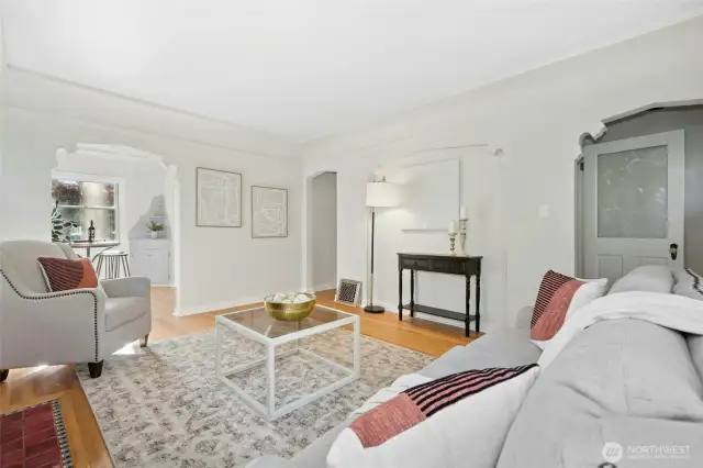 Living room with adjoining eating nook. Notice the cove ceiling detail.