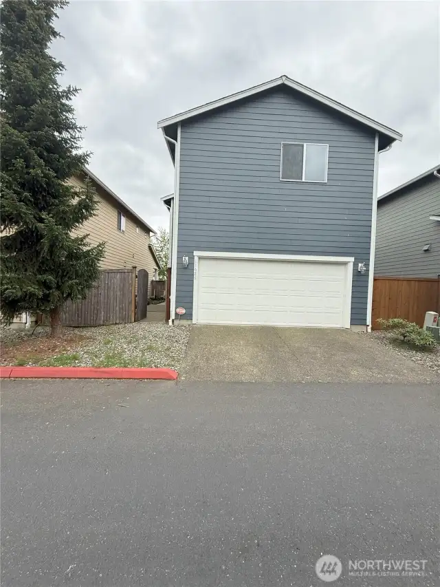 Rear street view and garage entrance