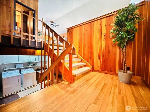 Looking down to main level to bedroom