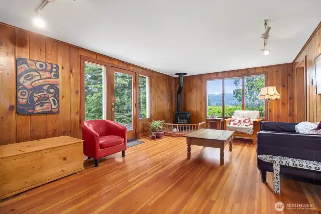 The living room walls are of knotty pine and the contract with that and the fir floors makes this room so cozy and so relaxing.