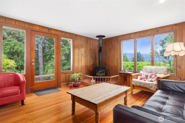 There is a lovely deck 2" thick wooden deck off the living room to enjoy nature and the serenity of the yard and landscape.