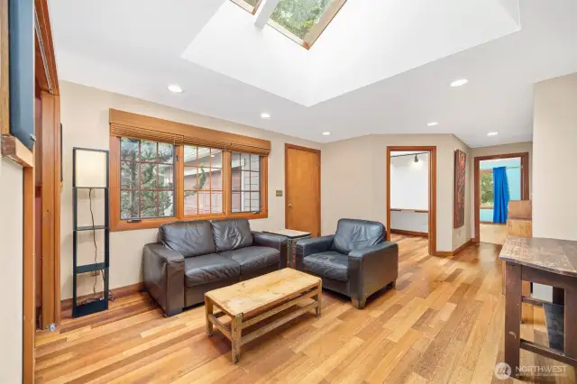 The TV or family room opens to the office or den and also to the huge garage (door between the office and the large window). It has beautiful Kempas wood floors which are gorgeous and scores very high on the Janka hardness scale, making them very durable.