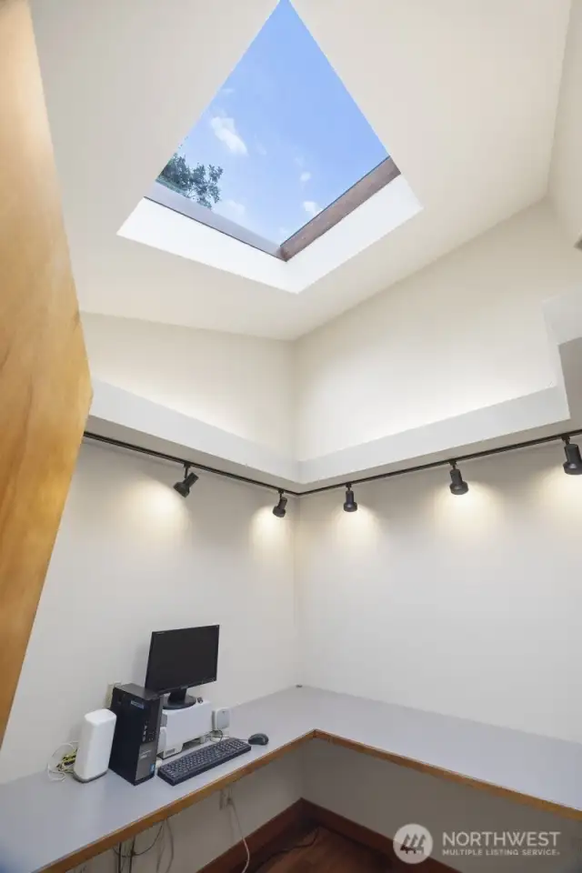 Looking up at the skylight in the office that brings in so much natural light.