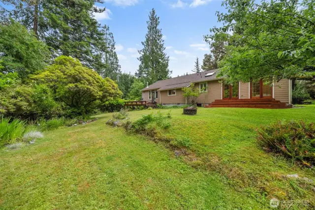 Looking up to the rear of the home from the lawn below.