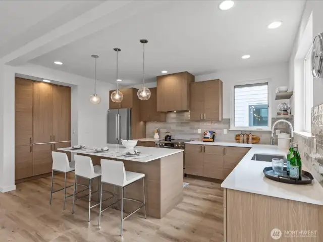 Cook & craft to your heart's content in this well-designed kitchen with island! Model home.