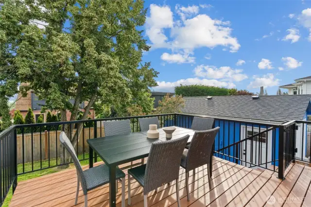 Peaceful and private, this deck offers the perfect setting for entertaining or relaxing in the serene backyard.