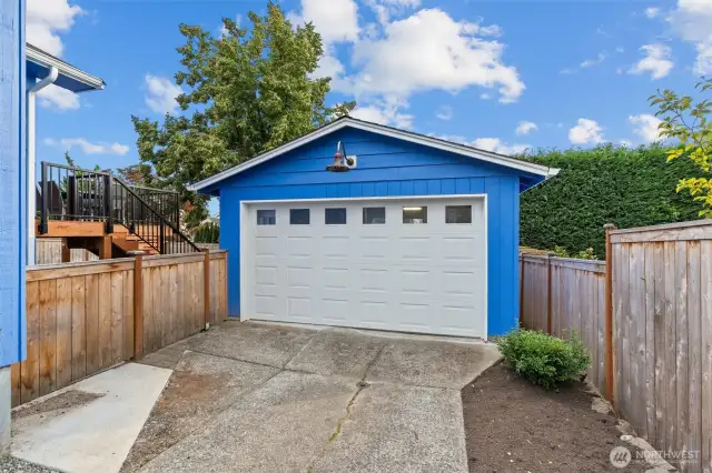Oversized one-car heated garage featuring a new door, 100-amp service, and a dedicated 20-amp outlet—perfect for projects, storage, or a workshop setup.