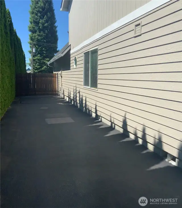 Asphalt side driveway long enough for 2 RVs
