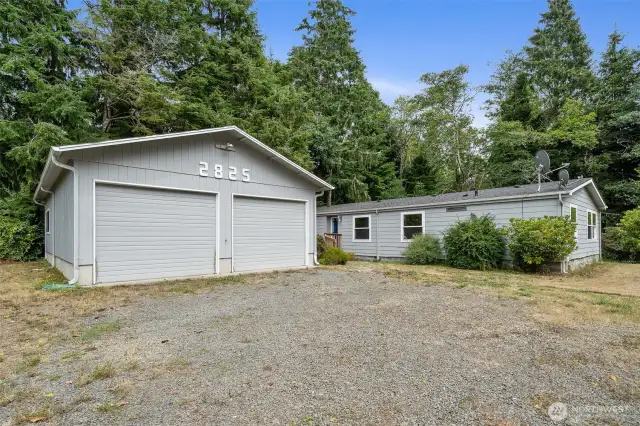Front of house with detached double car garage