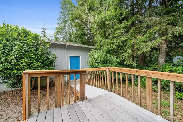 Front deck facing man-door to garage