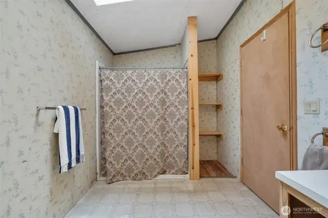 Bathroom with low clearance walk-in shower