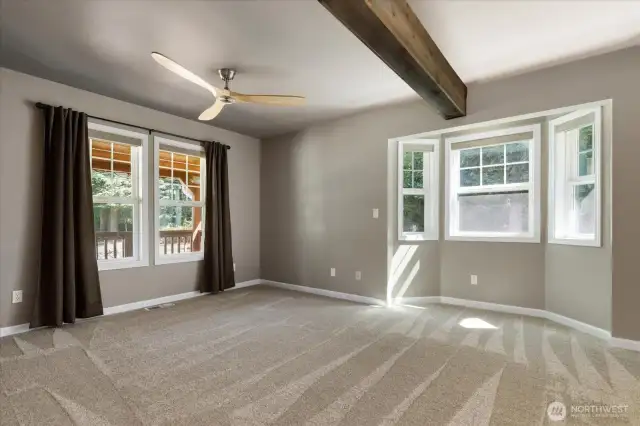 Primary bedroom with ceiling fan
