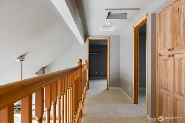 Hallway upstairs which is open to 1st floor living room