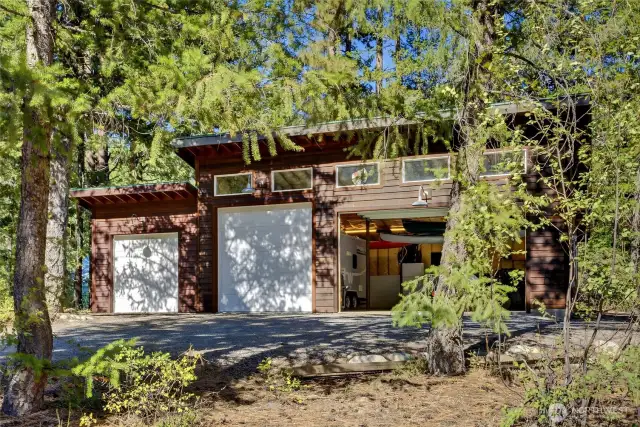The residential building lot currently features a 1000’ 4-bay garage.