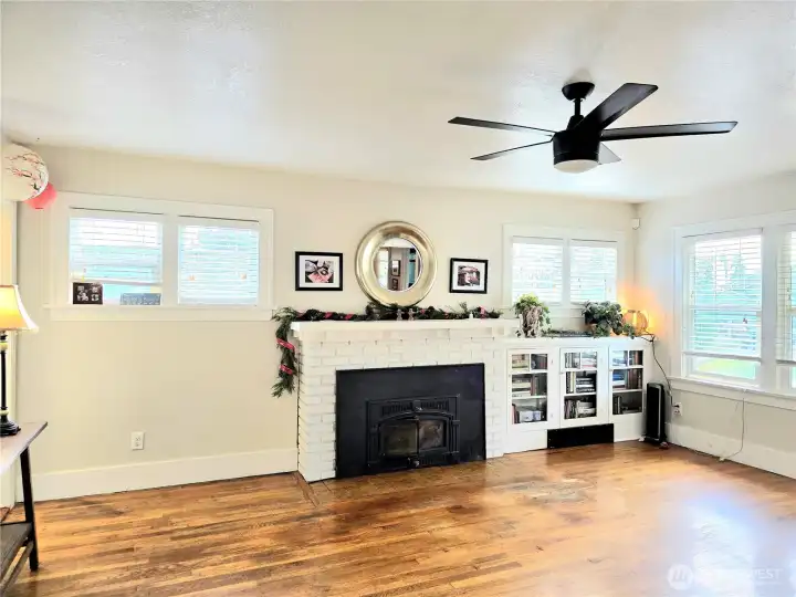 Wood stove and built ins with lots of windows. Great light!