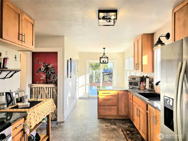 Kitchen & dining rooms. Stairs to lower level.