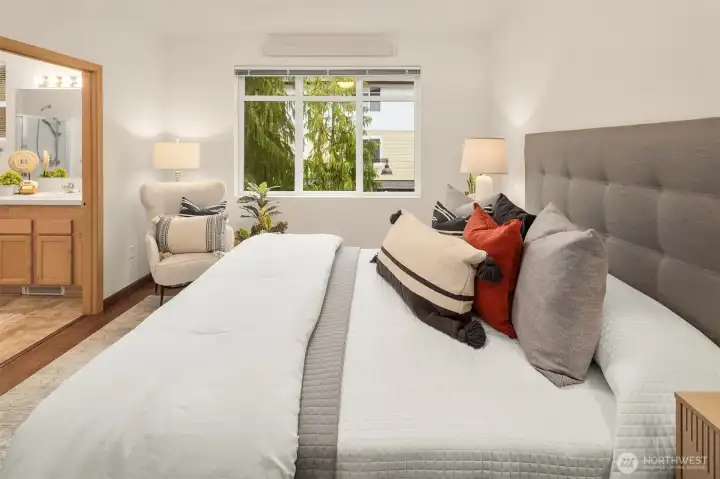 Another view of the primary suite with an en-suite bath