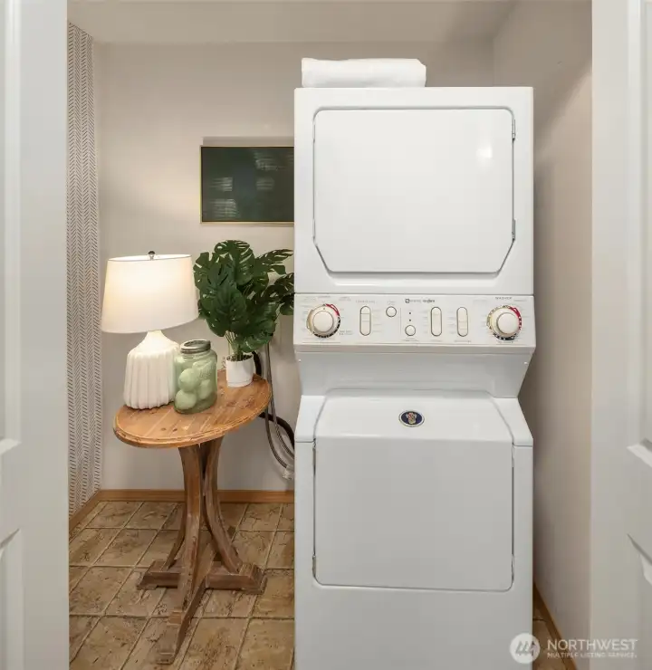 The utilities are conveniently located in the hall bath. Since they are not located in the hall, you can close the bathroom door while doing laundry for a more quiet experience.