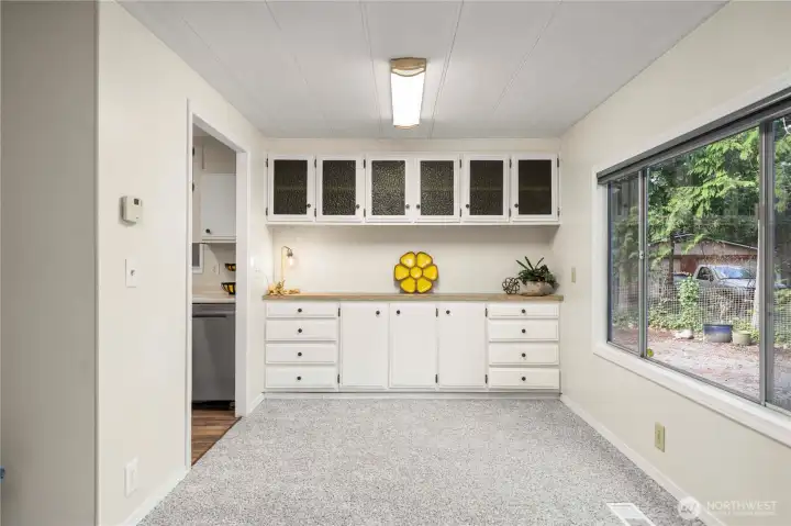 Built in cabinetry with abundant storage and retro glass doors