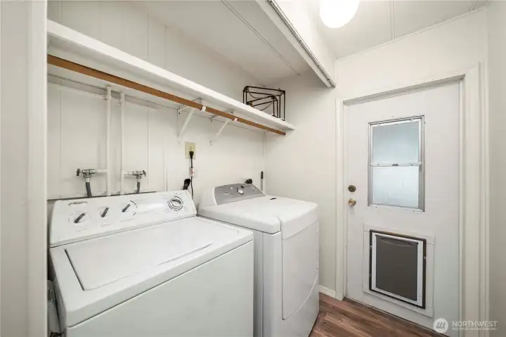 Mud room with full size washer and dryer and direct access from back yard