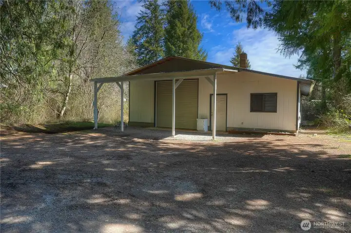 Large shop with an attached office provides excellent space for work, storage, or hobbies. Ideal for those needing a dedicated workspace with added functionality and flexibility.