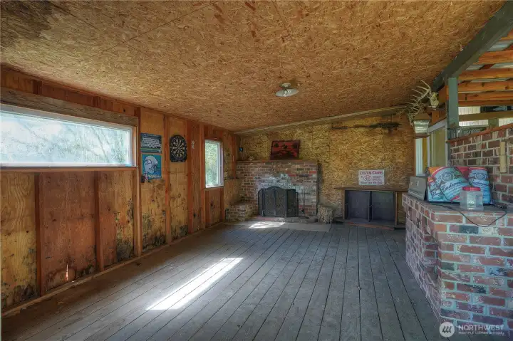 Cozy fireplace game room offering the perfect space for relaxing and gathering. Ideal as a family retreat area for entertainment, games, or unwinding in a warm, inviting setting.