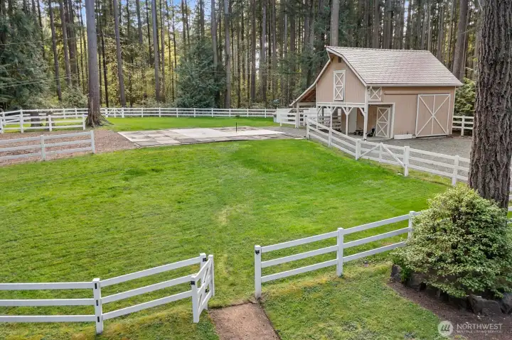 Barn w/ hay loft, shavings bin, tack storage, and grooming area. Potential for stalls.