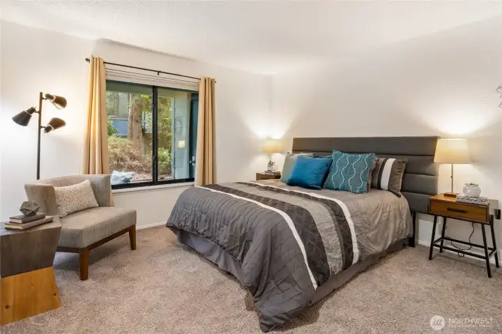 The primary bedroom is wonderfully spacious, with enough room to easily accommodate a king-sized bed.
