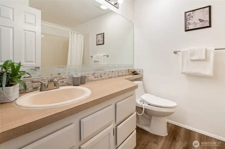 Full bathroom adjacent to the second bedroom.