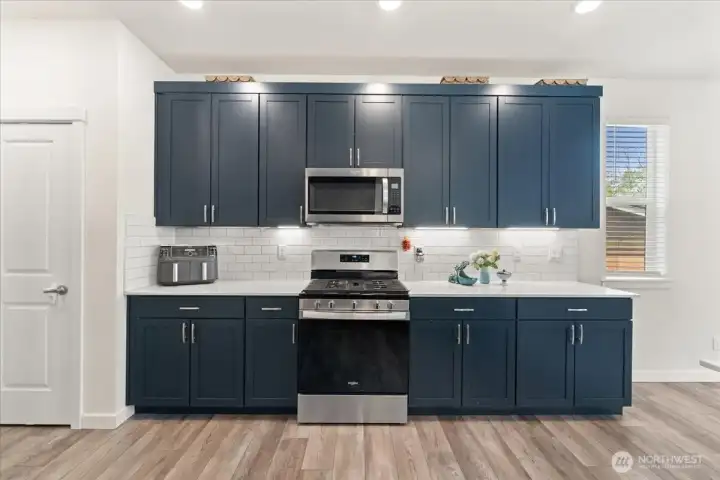Deep blue cabinetry adds timeless charm and character to the kitchen. Deep blue cabinetry adds timeless charm and character to the kitchen.