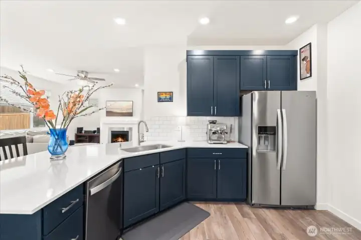 Stunning kitchen with quartz counters, subway tile, and stainless appliances. Stunning kitchen with quartz counters, subway tile, and stainless appliances.