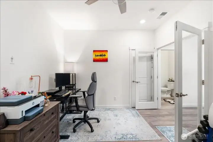 Main-floor bedroom ideal for guests, office space, or multigenerational living. Main-floor bedroom ideal for guests, office space, or multigenerational living.