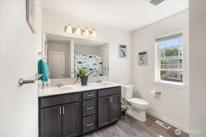 Upstairs full bath with double sinks. Upstairs full bath with double sinks.