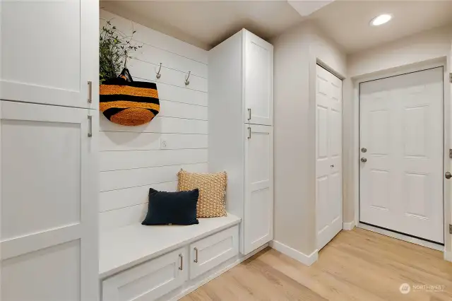 Stunning mudroom/laundry room connects to the shop.