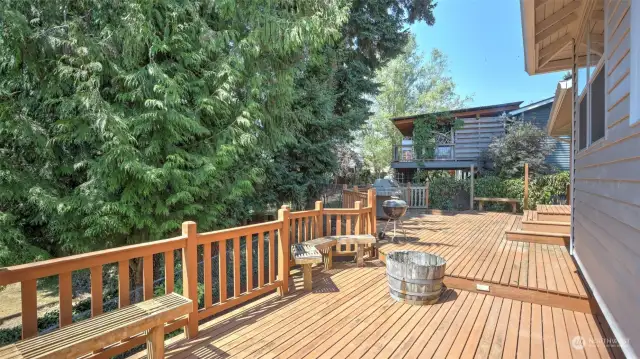 Just steps from the first portion of the deck you will find this lovely level with built-in benches.