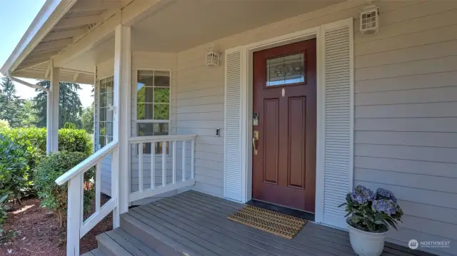 Enjoy covered front porch to greet your guests rain or shine!