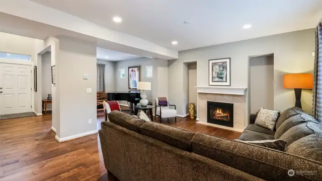 Cozy living room with hardwood floors upon entering the house.