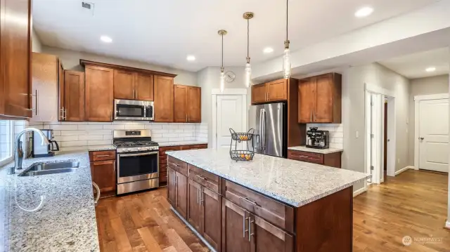 This room features the island and tiled countertop of the kitchen.