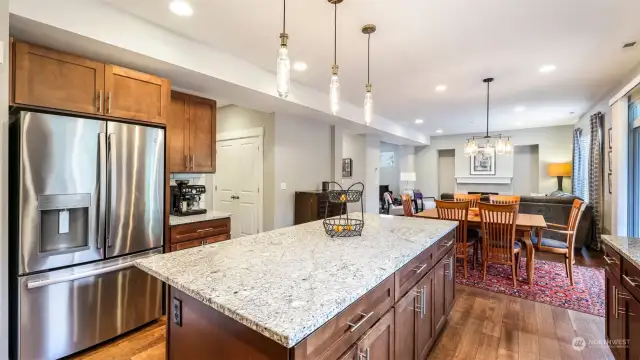 This angle features the dining room adjacent to the kitchen and sightline of the cozy living room.