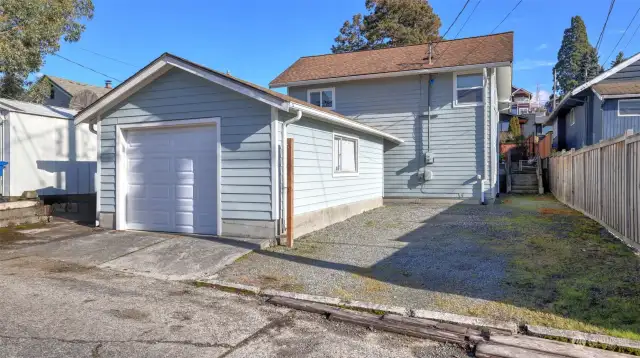 Oversized one car garage off the alley with 2 additional spots.