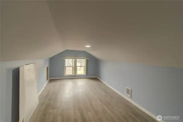 Upstairs workspace can be used as extra bedroom or for business storage