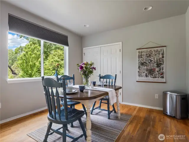 Eat-in kitchen space or maybe use this area for a game table. Double doors open to a pantry.