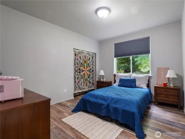 One of the three bedrooms located on the main floor. All with 9 foot ceilings, great neutral wall color, large windows, and either luxury laminate flooring or wall to wall carpet.