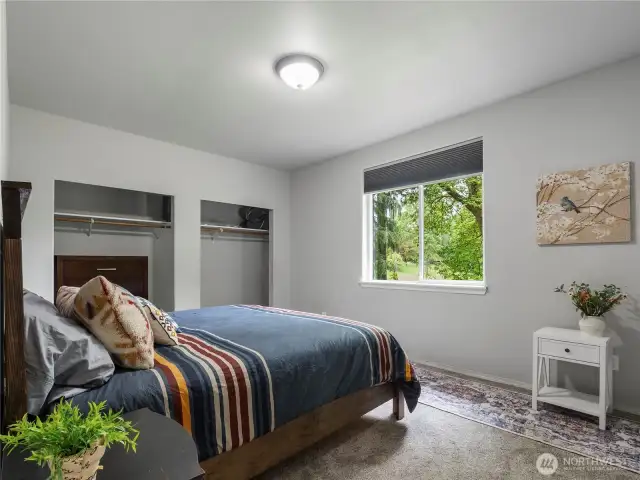 3rd bedroom with wall to wall carpet and double closets.