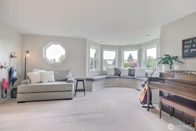 Step into a spacious and light-filled living room designed for comfort and creativity.