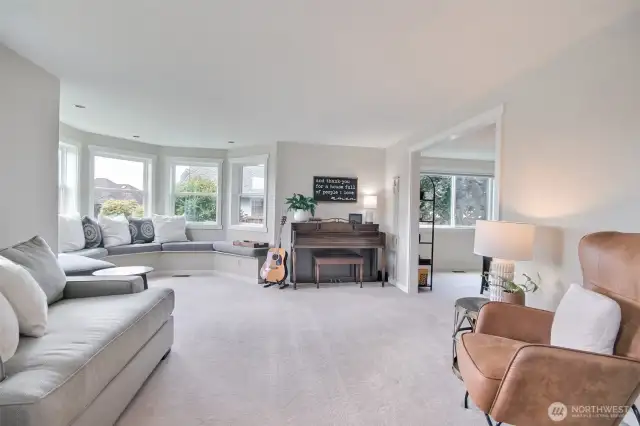 The neutral-toned carpeting and walls provide a calming backdrop, while the built-in bench seating is perfect for lounging or entertaining guests.